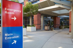 Main Entrance Of Modern Hospital Building With Signs